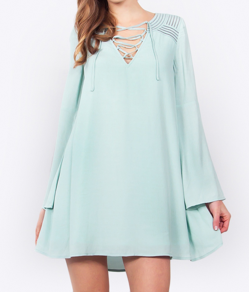 mint colored dress with bell sleeves blue labels boutique